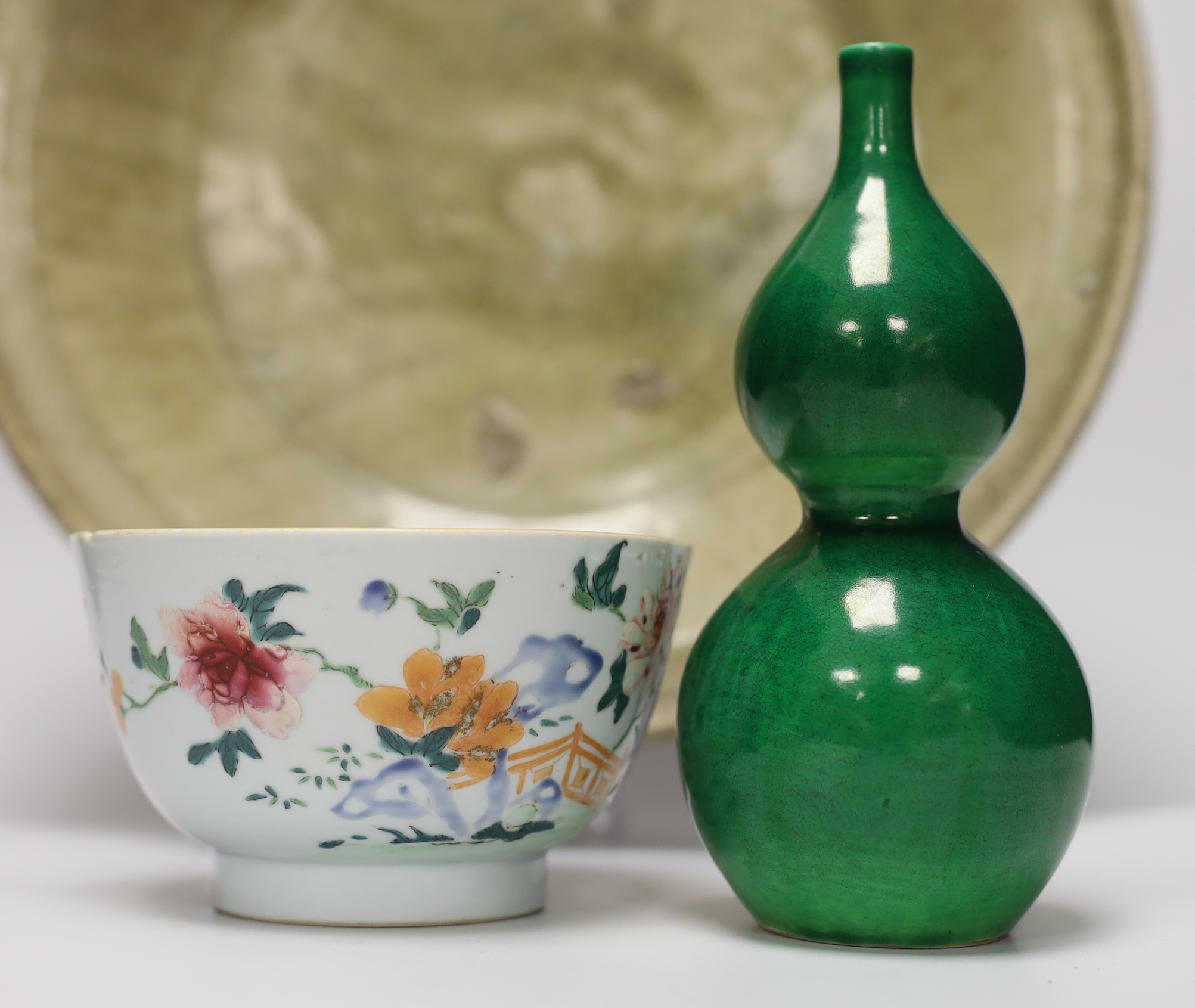 A Thai Sawankhalok celadon dish, 35cm, four rice and tea bowls and a double gourd vase